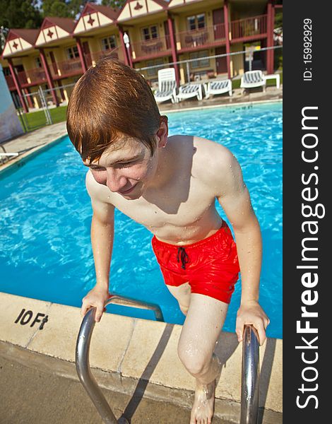 Child has fun in the outdoor pool. Child has fun in the outdoor pool