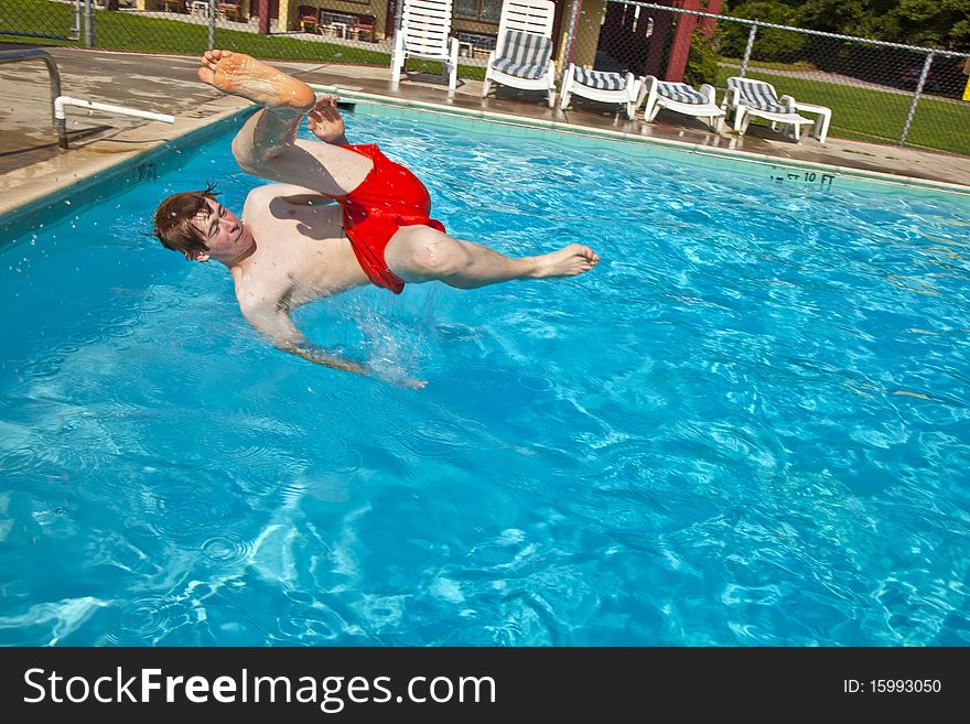 Child has fun jumping in the pool. Child has fun jumping in the pool
