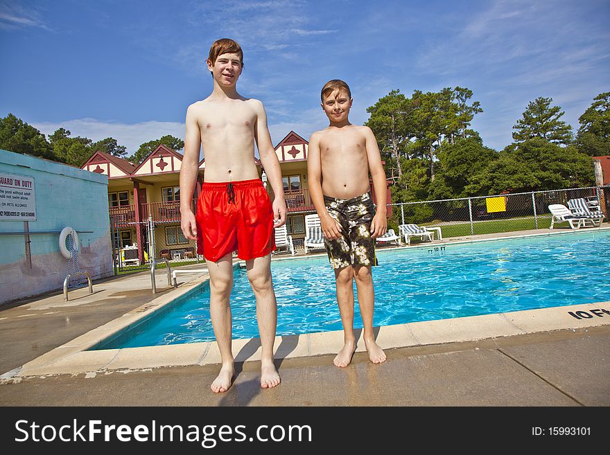 Two brothers having fun at the pool