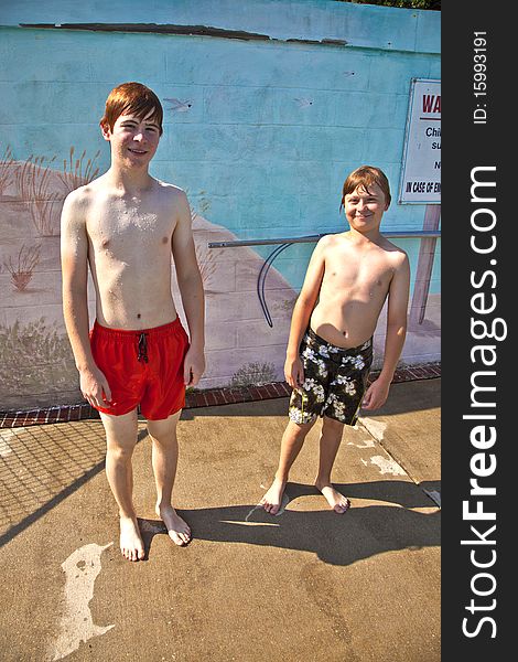 Two brothers having fun at the pool