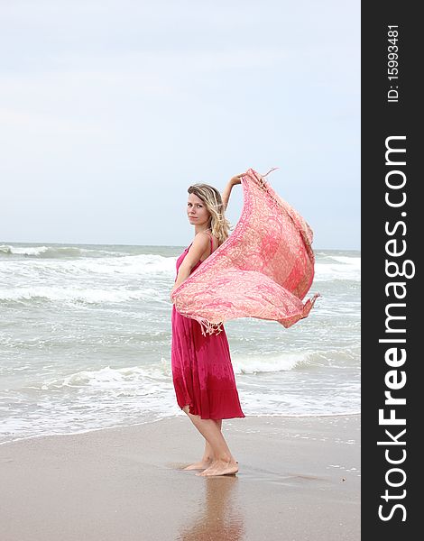 Woman standing near the sea. Woman standing near the sea