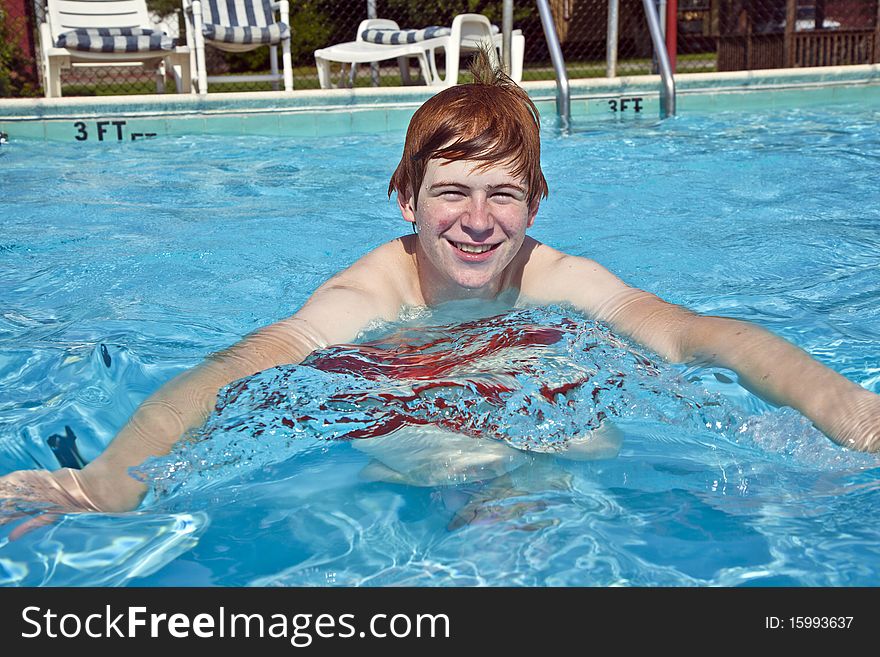 Boy  Has Fun In The Pool