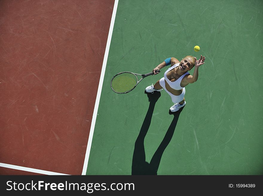 Young Woman Play Tennis Outdoor