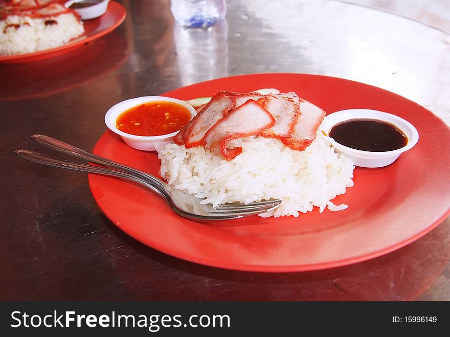 Chinese street food, Char siew rice as served at local restaurants all over Asia, in this case in Singapore.
