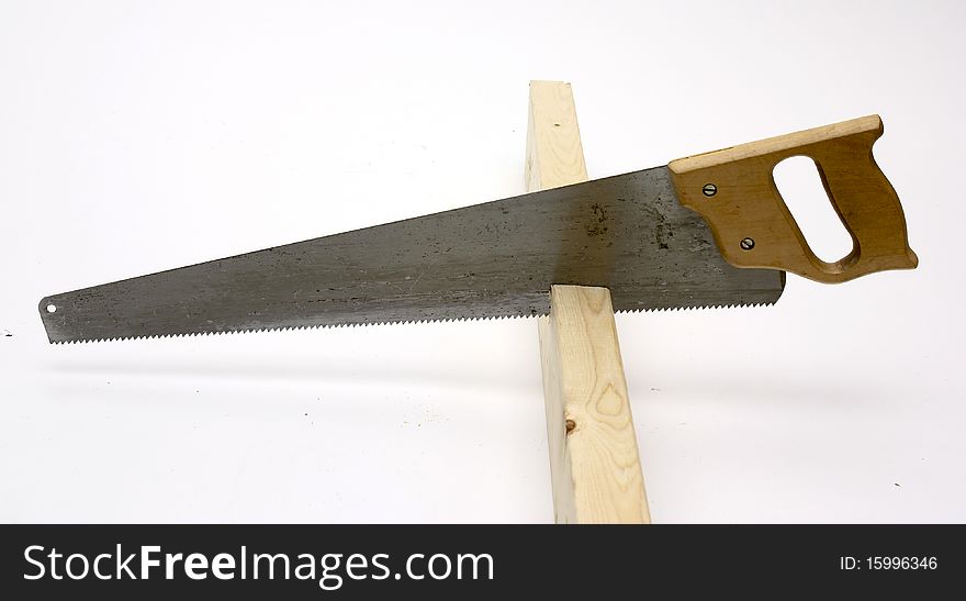 Hand saw cutting wood