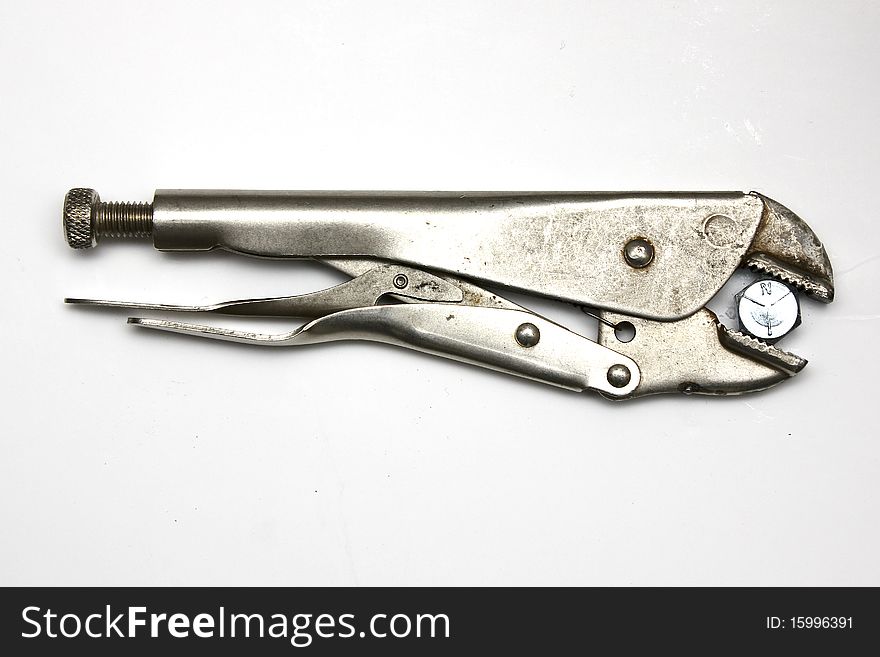 Pliers holding a bolt on white background