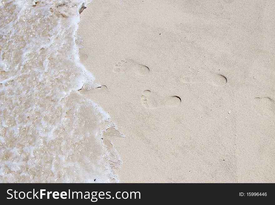 Feet marks on a ocean beach