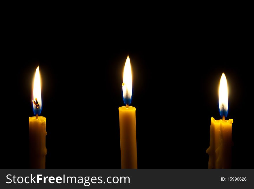 Candles isolated on black background