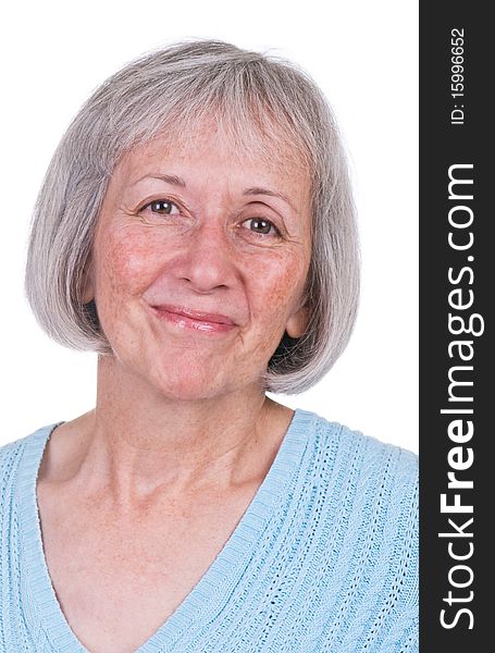 Smiling senior woman wearing blue sweater. Smiling senior woman wearing blue sweater