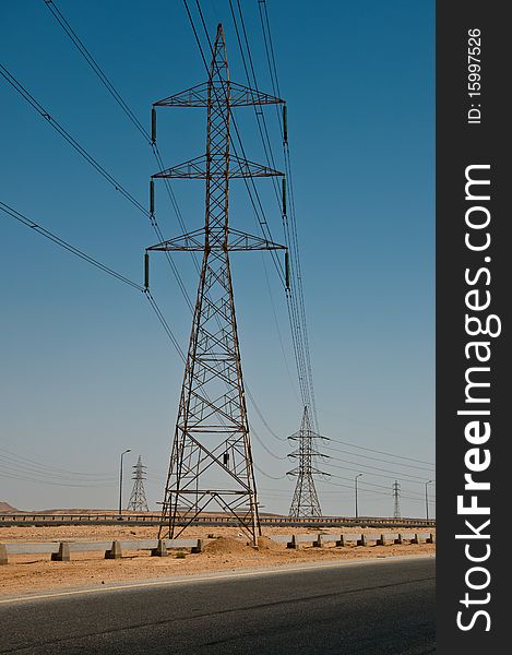 Electric lines across a dessert road