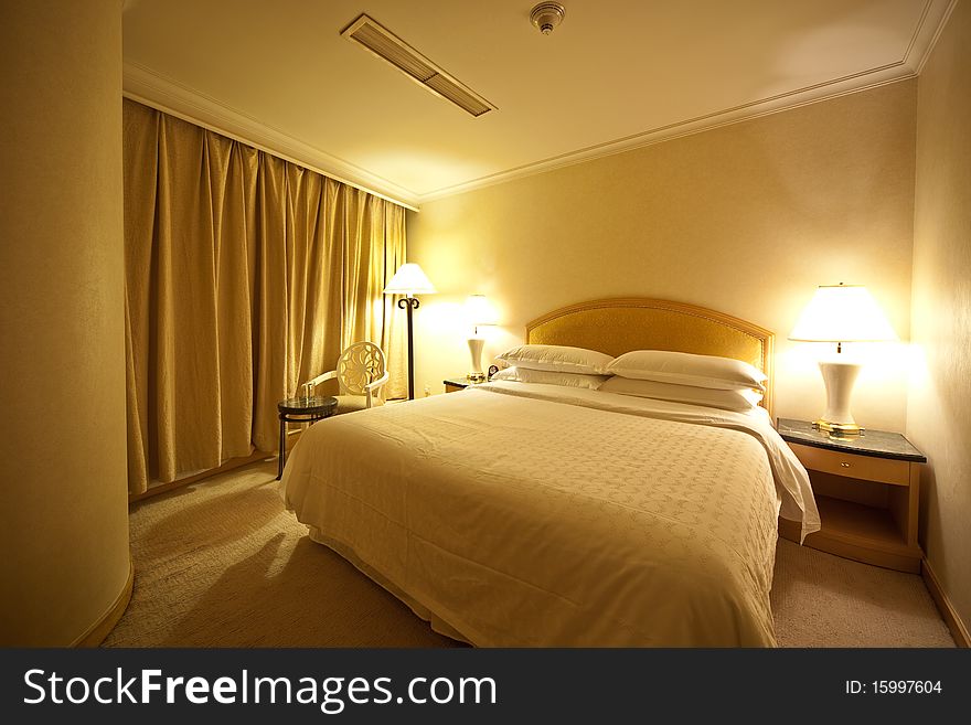 Contemporary Hotel Bedroom with three lights