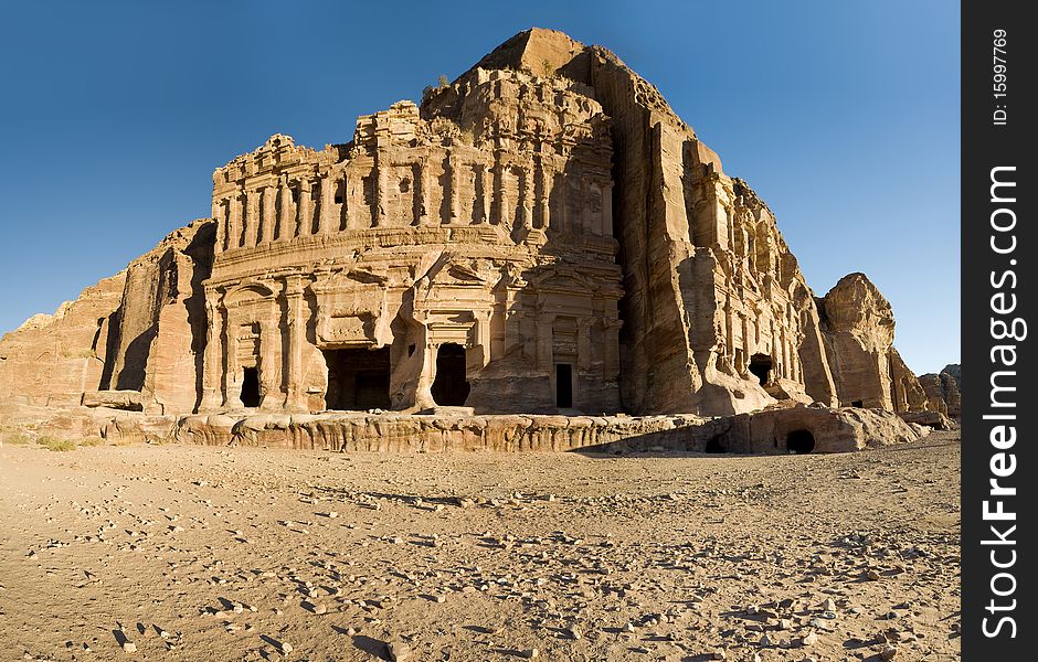 Facade of broken ancient amphitheater in Petra desert