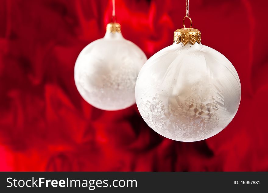 Christmas baubles on red background.Studio shot. Christmas baubles on red background.Studio shot