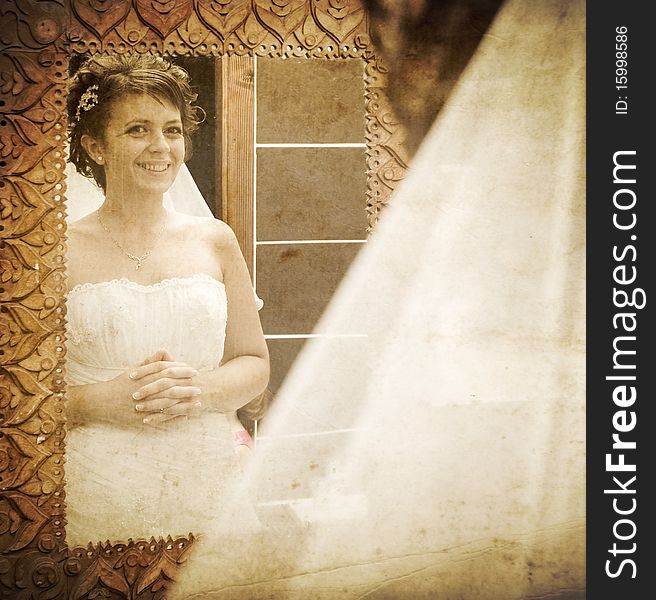 Vintage photo of bride looking into mirror