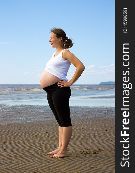 A pregnant girl on the shore of the White Sea.