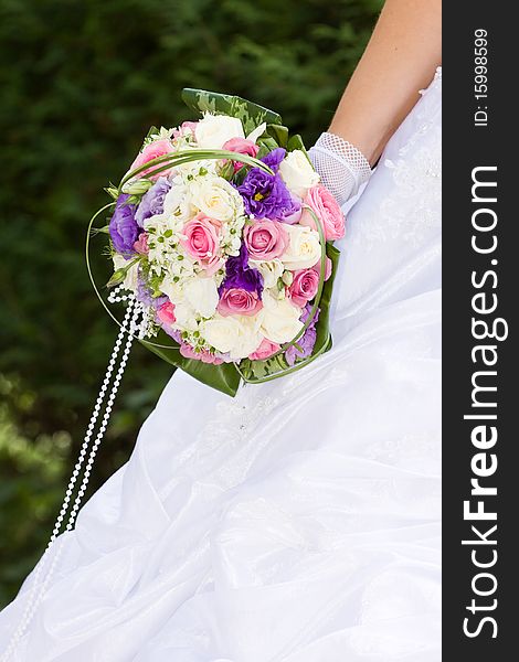 Colorful wedding bouquet in bride's hands