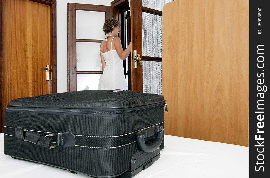 Woman arriving in  pension bedroom