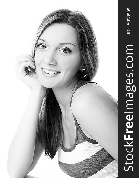 Closeup portrait of cute young girl smiling against white background