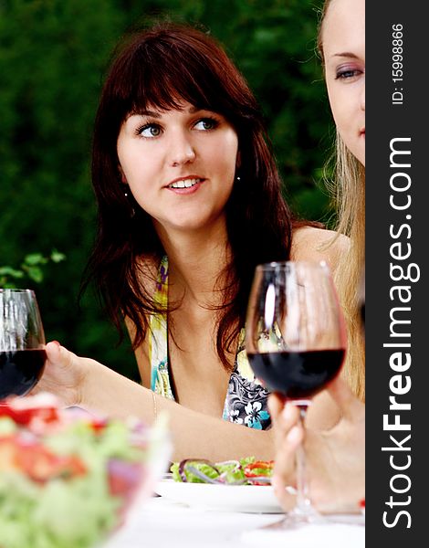 Group of young and beautiful womens drinking wine in the park. Group of young and beautiful womens drinking wine in the park