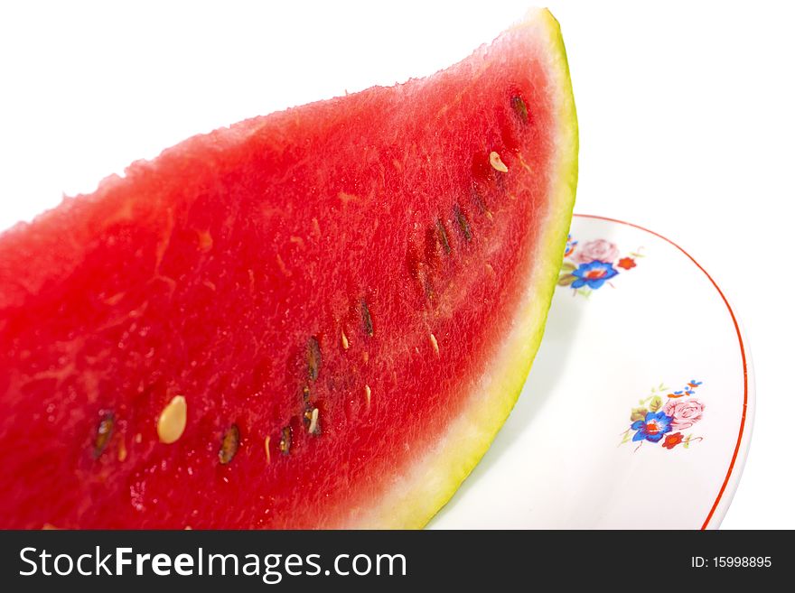 Watermelon on plate isolated on white. Watermelon on plate isolated on white