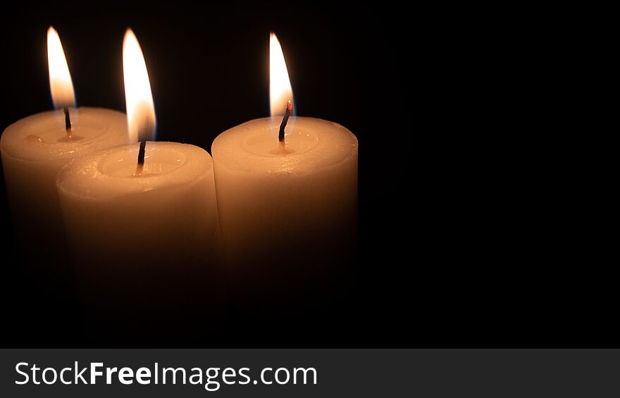 Burning Candles On A Black Background With Space To Put Any Text