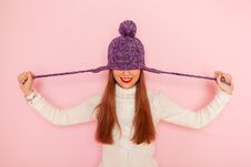 Fashion Happy Young Woman In Knitted Hat And Sweater Having Fun Over Pink Background. Smiling Royalty Free Stock Photo Fashion Happy Young Woman In Knitted Hat And Sweater Having Fun Over Pink Background. Smiling Royalty Free Stock Photo