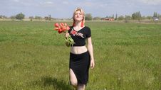 Young Woman With Bouquet Of Tulips In The Field. Stock Photos Young Woman With Bouquet Of Tulips In The Field. Stock Photos