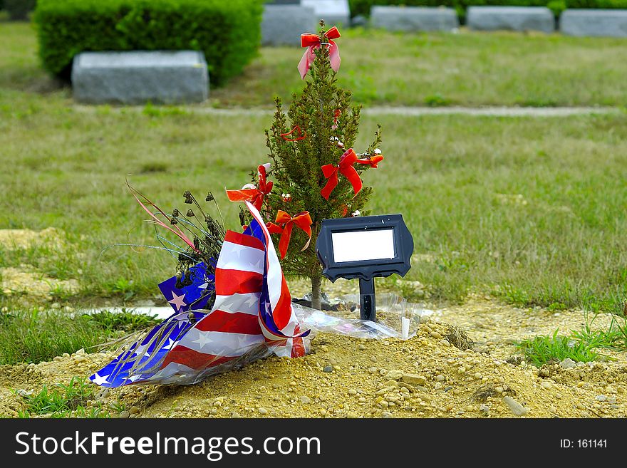 Grave With Flowers and a Tree. Grave With Flowers and a Tree