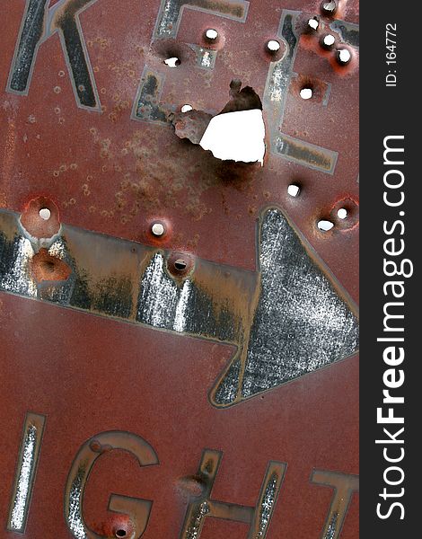 keep right sign, rusting and laden with bullet holes. keep right sign, rusting and laden with bullet holes