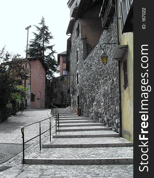 Wide stairs, narrow street,an alley surrounding by great stones wall houses - Annecy France. Wide stairs, narrow street,an alley surrounding by great stones wall houses - Annecy France