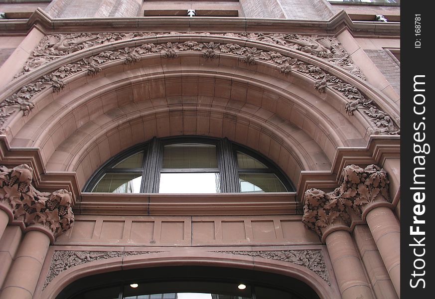 Arch with with large red keystone, '500' numeral and green entrance above door. Arch with with large red keystone, '500' numeral and green entrance above door.