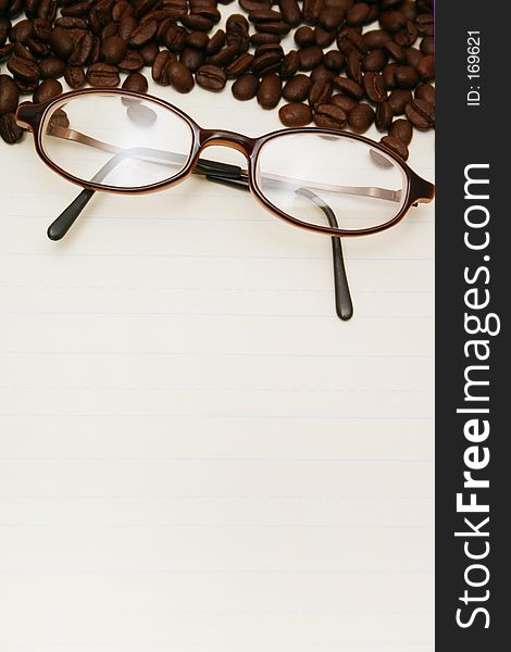 Lined loose leafpaper with coffee beans and glasses. Lined loose leafpaper with coffee beans and glasses