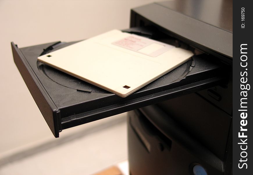 A diskette inserted in the CD tray of a computer. A diskette inserted in the CD tray of a computer