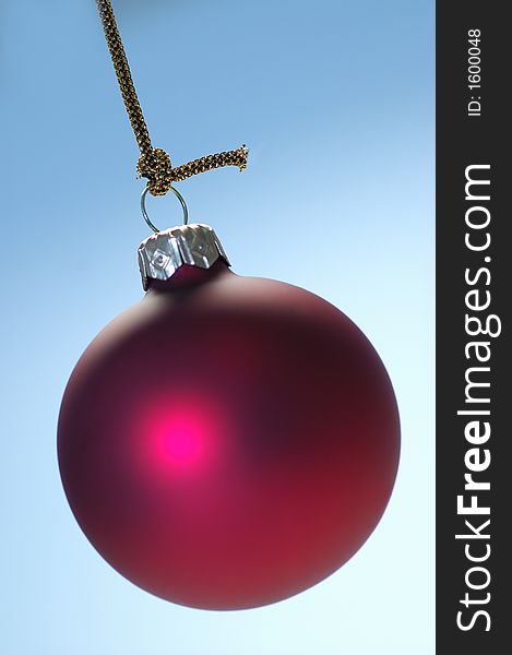 Christmas decoration red ball on blue background. Christmas decoration red ball on blue background