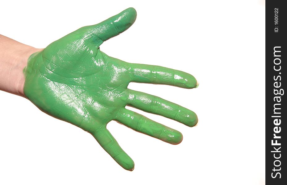 A womanish palm is painted green paints on a white background