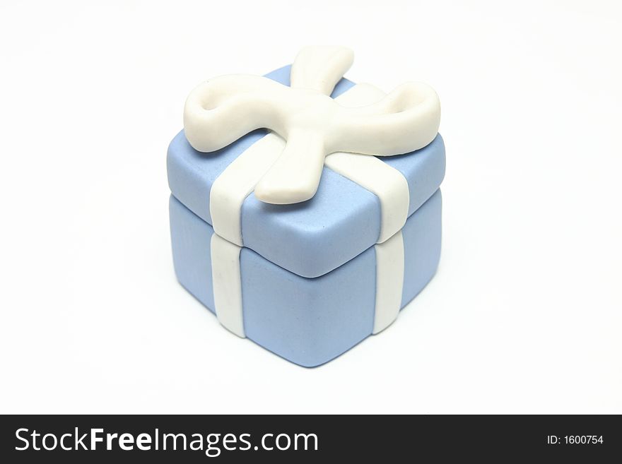 Blue Porcelain Gift Box with White Ribbon against white background