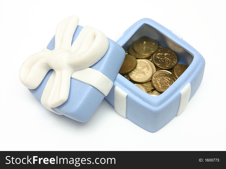 Blue Porcelain Gift Box filled with gold coins with White Ribbon against plain background