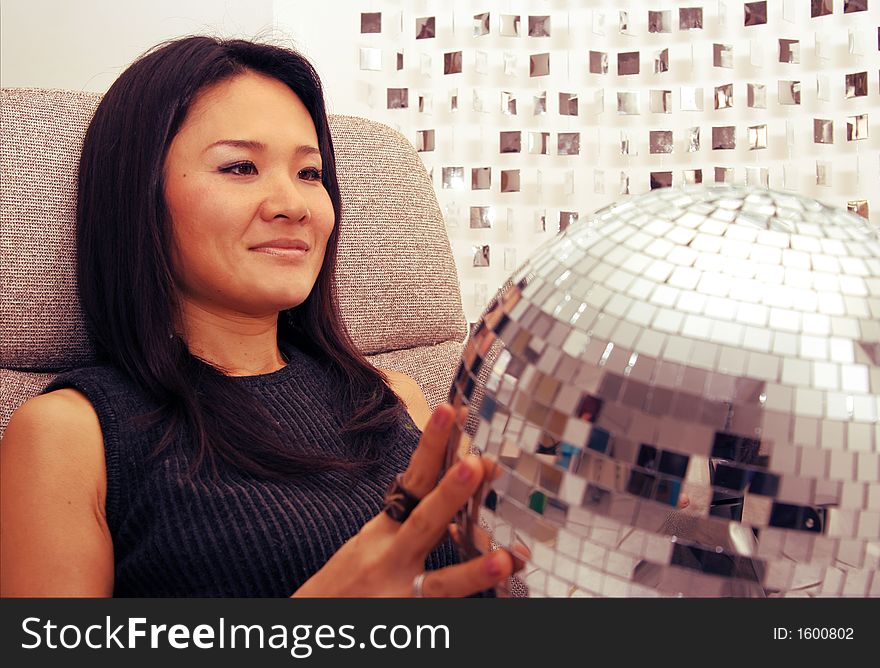 Japanese Woman Holds Glitterball