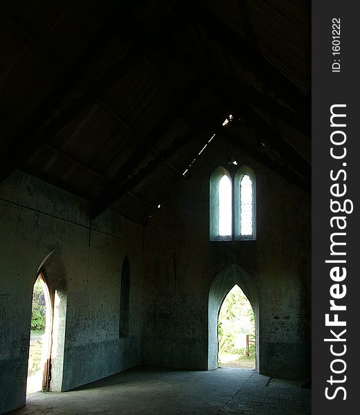 Light filtering through windows & doors of an abandoned building at Narayanpur, near Pune India.