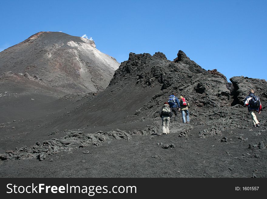 Hikers climbing to crater edge of mount etna. Hikers climbing to crater edge of mount etna