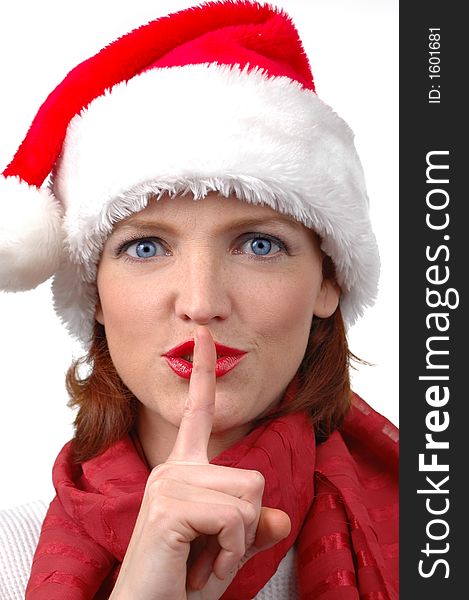 Woman with Santa's hat with silence sign