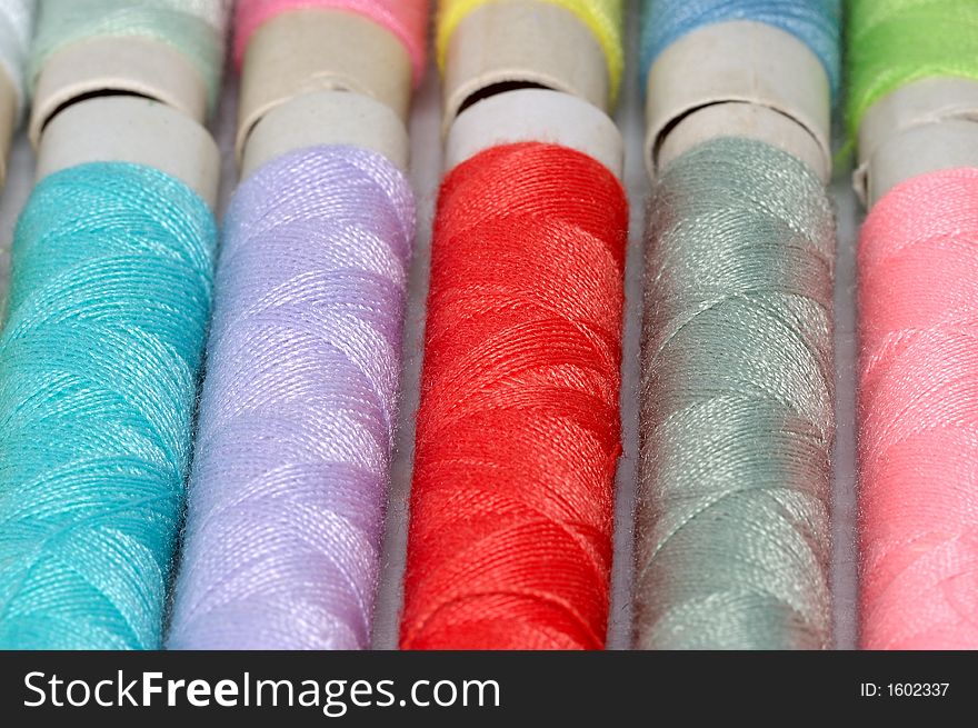 Macro shot with assorted colors reels of thread. Macro shot with assorted colors reels of thread