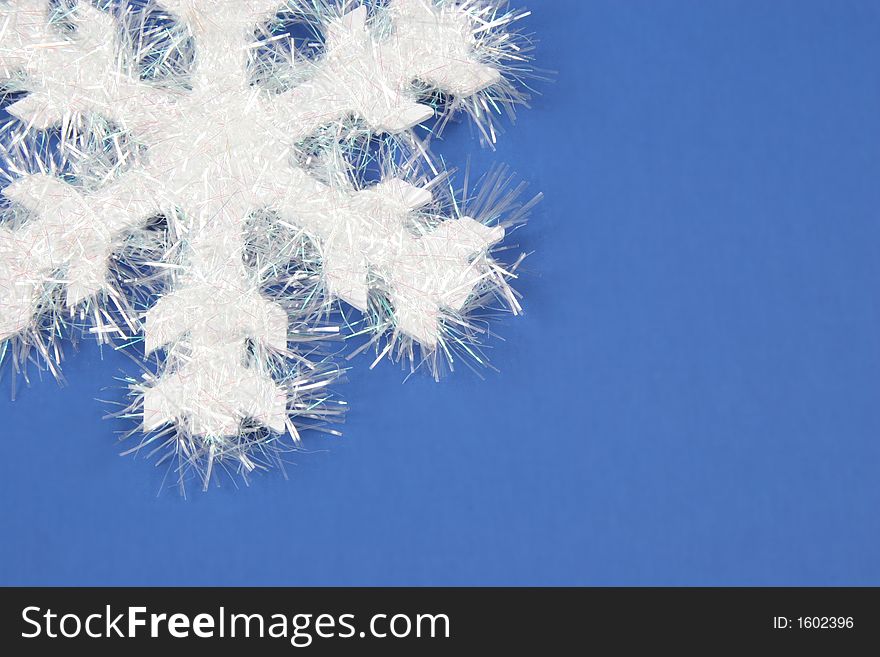 White snowflake on blue background