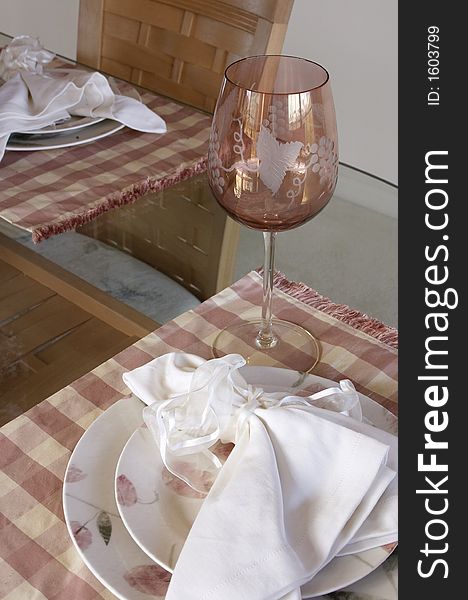 Wine glass and table setting. Wine glass and table setting