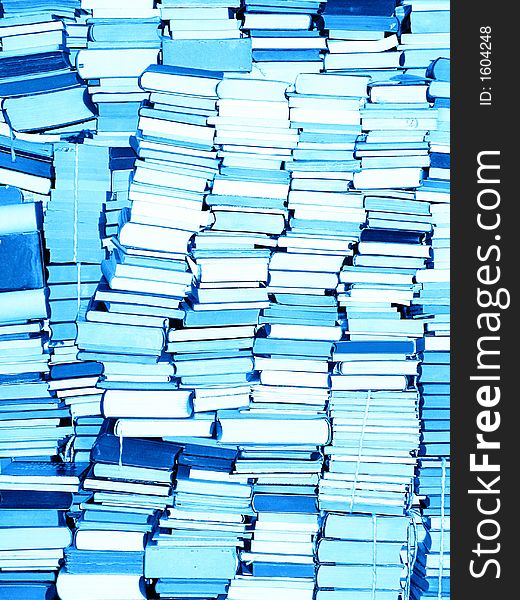 Stacked books after moving - for sale. Blue tone. Stacked books after moving - for sale. Blue tone.