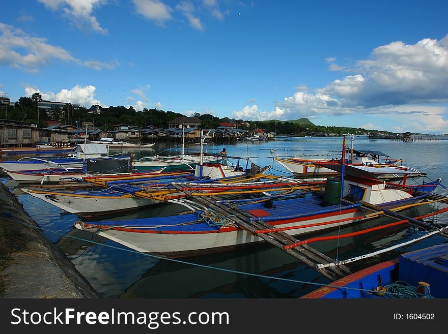 Asian village port with fishermen�s boats.