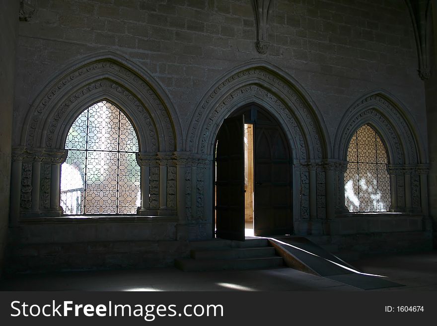 Door and windows in a european monastery, possible concepts: enclosed, freedom. Door and windows in a european monastery, possible concepts: enclosed, freedom
