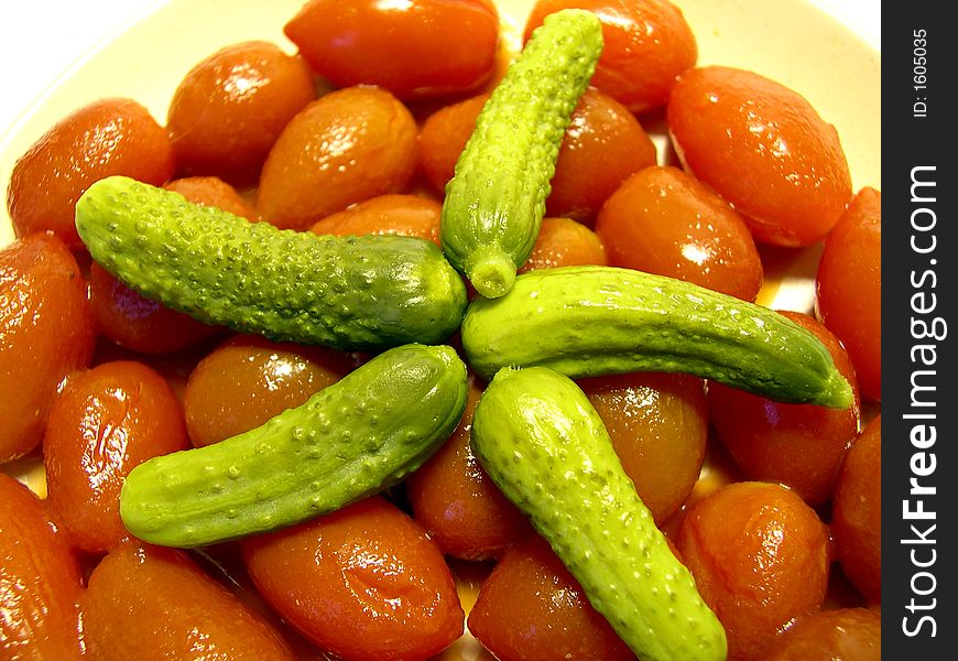 Small cucumbers and tomatoes on a plate