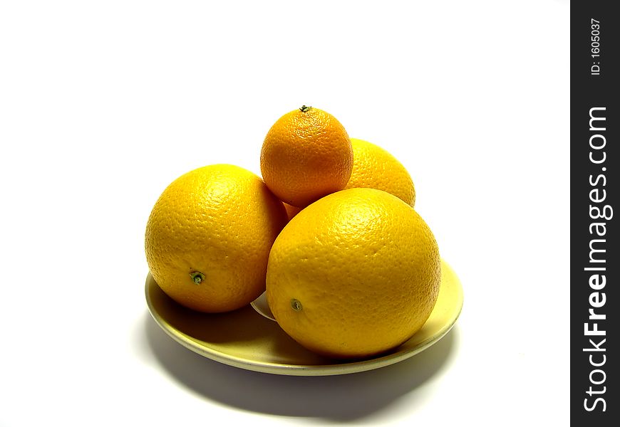 Tangerine and oranges on a plate