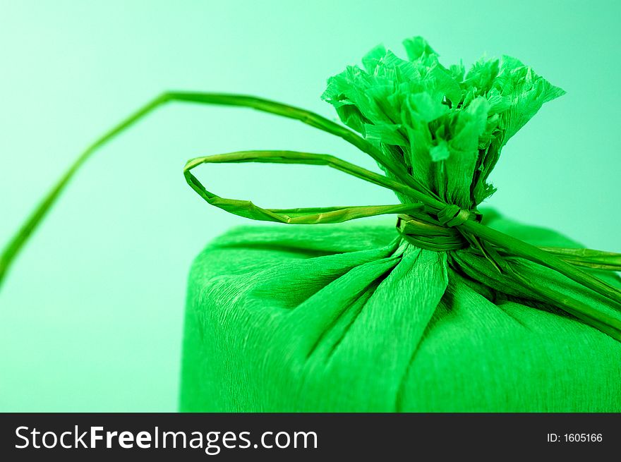 Green present with green ribbon.Present box. Green present with green ribbon.Present box.